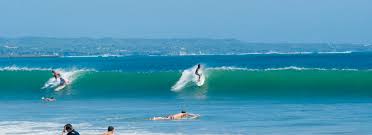 Surfing at Kuta Beach, Bali