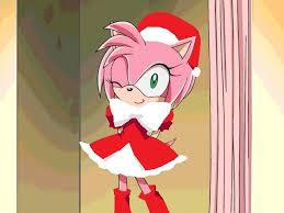 Amy Rose Dresses Up As Santa Claus