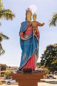 (Mary, Help of Christians) Mary holds Baby Jesus. Baby Jesus poses like the statue of Jesus Christ in Brazil