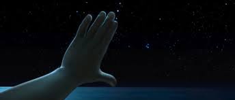 Moana holds his hand to the stars