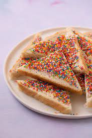 Recipe for Fairy Bread (What we need: 2 slices of bread, butter, sprinkles)