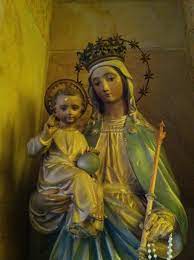 Image Description of Mary Help of Christians. It shows Mary holding a scepter in the left hand and Infant Jesus and a blanket on the right hand